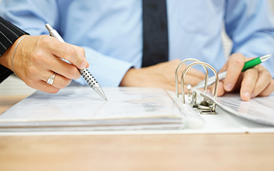 Two people going over paperwork