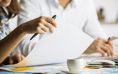 Two people going over paperwork together