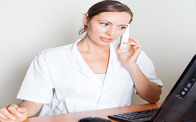 A female doctor talking on the phone