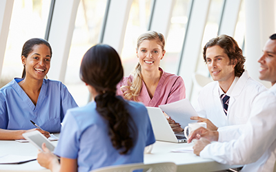 Team of professionals meeting around a table